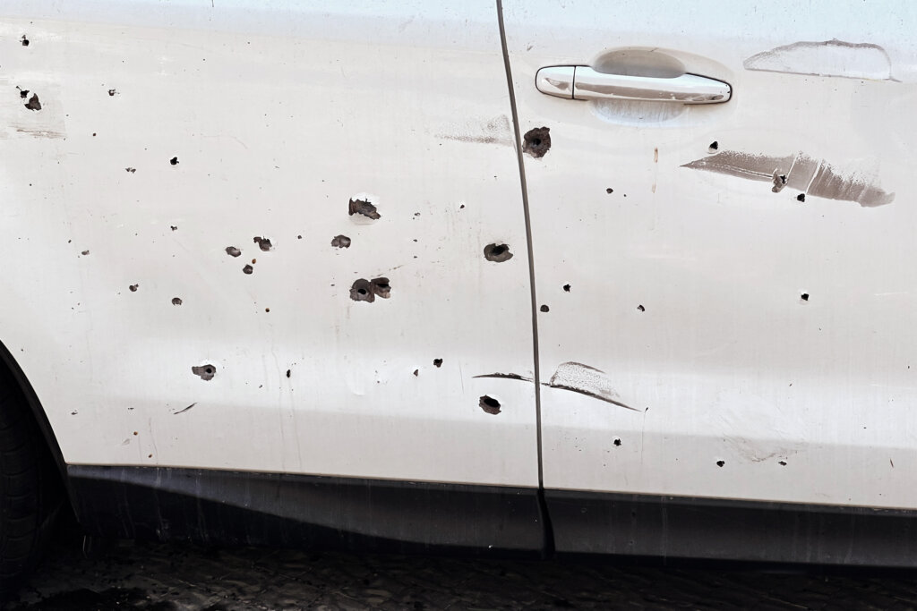 Bullet holes in car at Kfar Aza