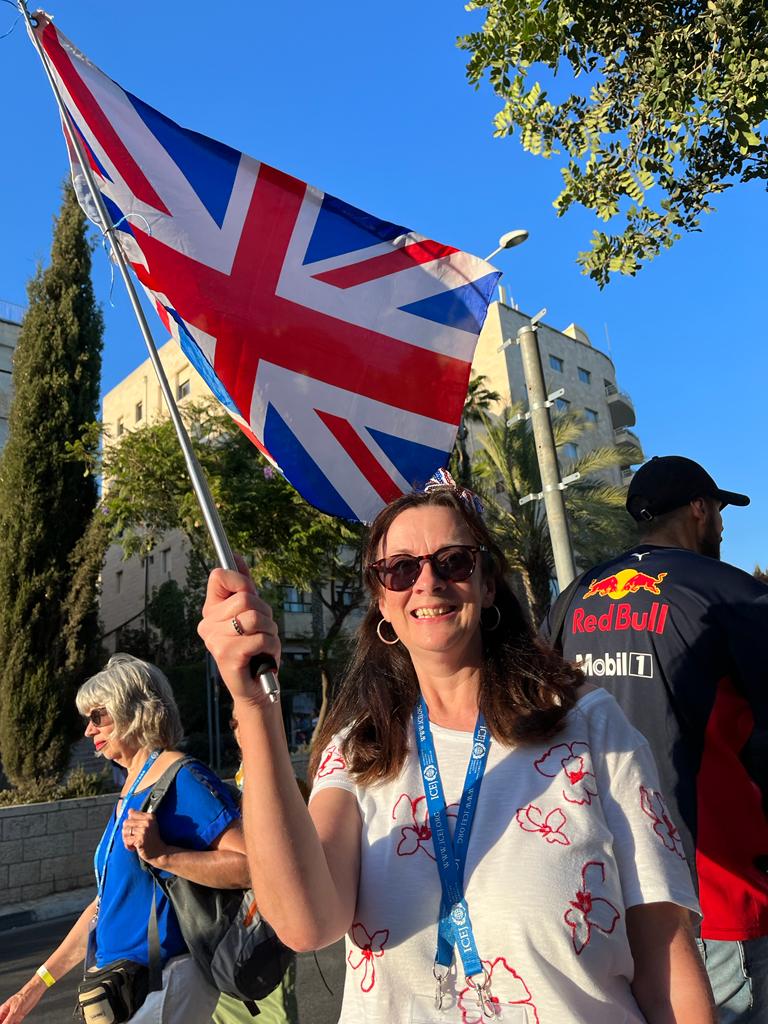 Mary from England carries Union Jack flag