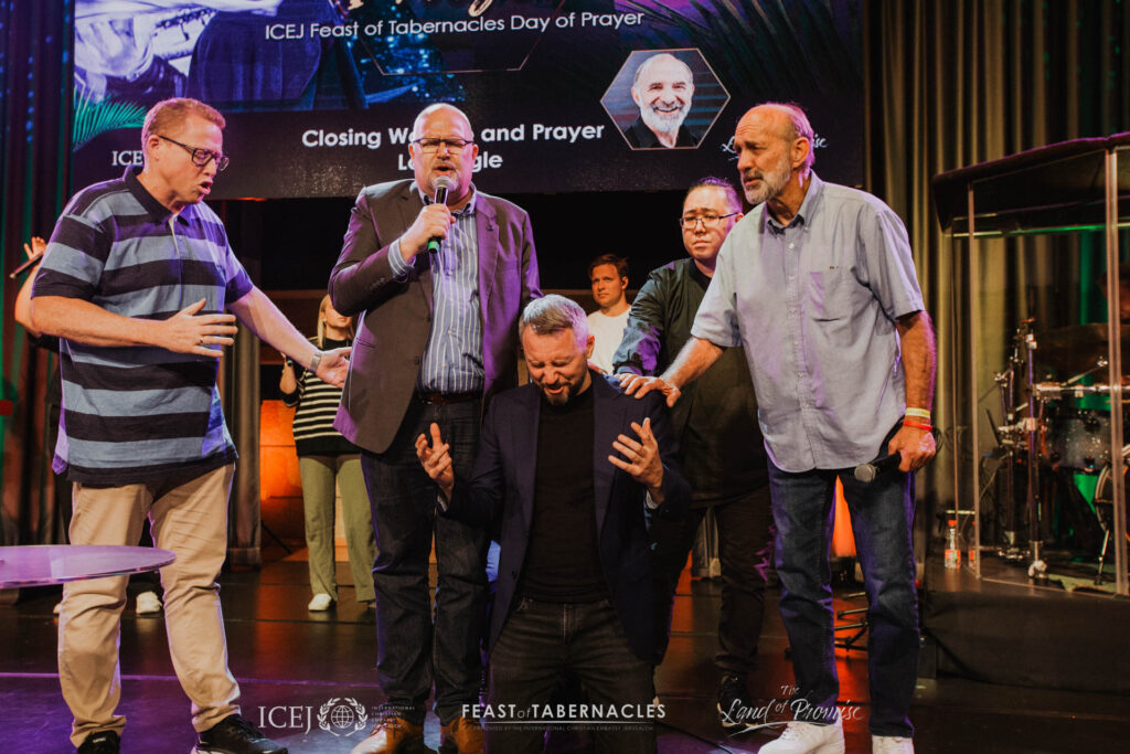 Lou Engle, Dr. Juergen Buehler and Dag  pray for Sergey