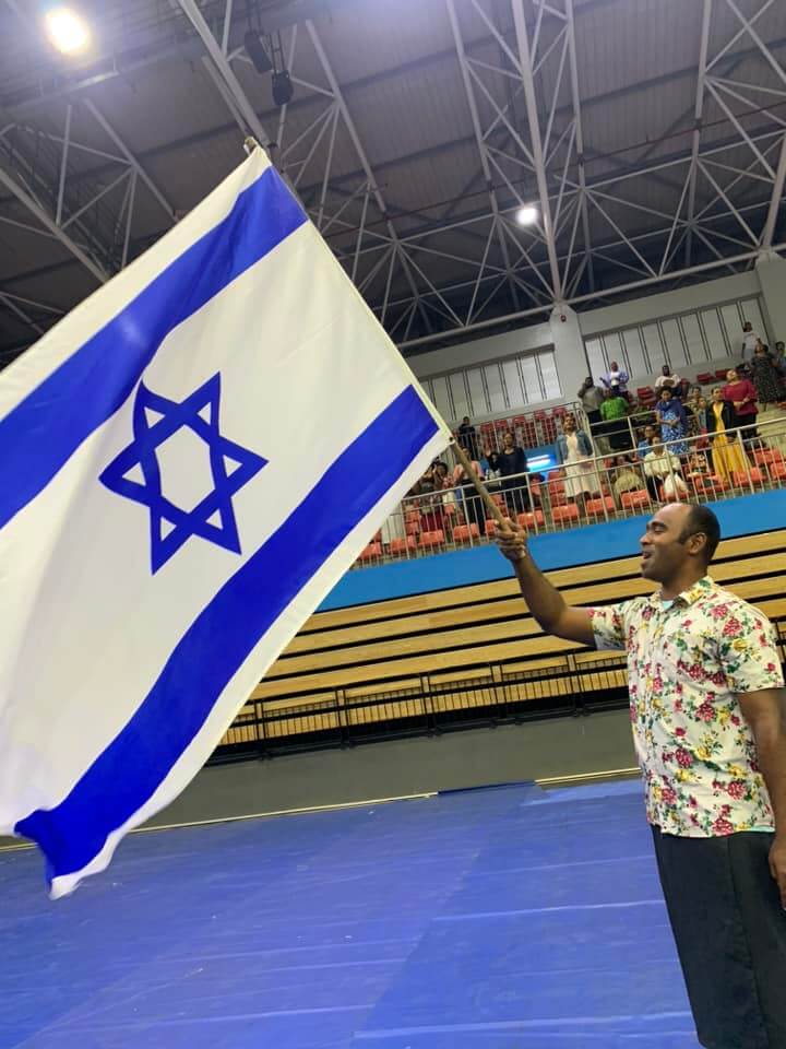 Fijian holding Israeli flag