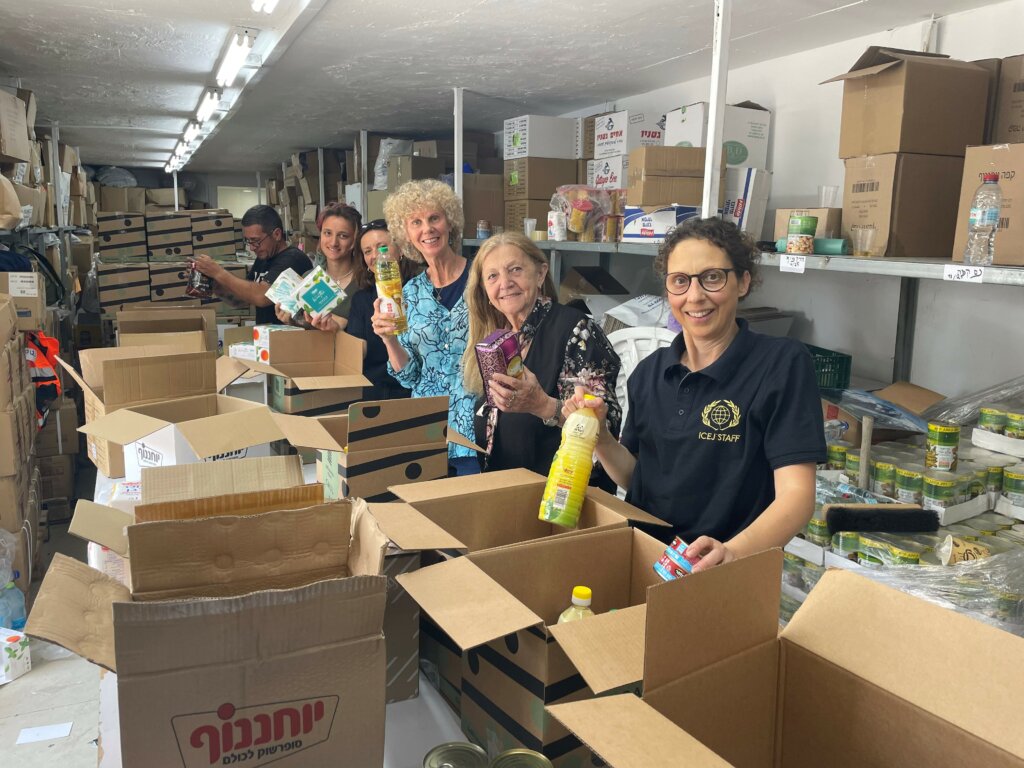 Packing Pesach packages for Holocaust survivors at the Haifa Home